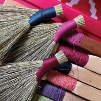 a selection of brooms and broommaking materials