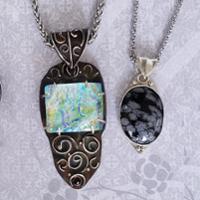 Two stone pendants in a handmade setting.