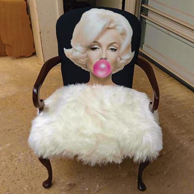 A custom chair featuring a Marilyn Monroe face that was completed by an upholstery student