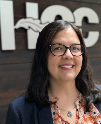 Dr. Shelley White in front of HCC sign